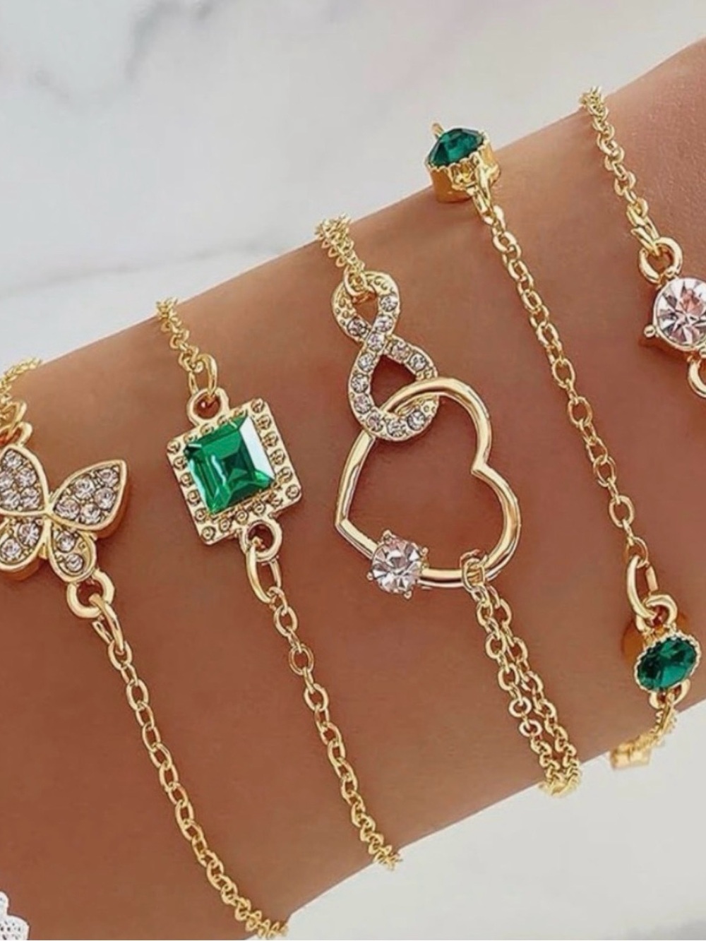 Gold-Tone Layered Bracelet Set with Green Accents. (5) Bracelets.